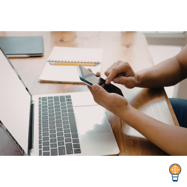 A simple call-back rota notebook and phone on a desk, representing a calm system for sales follow-up.